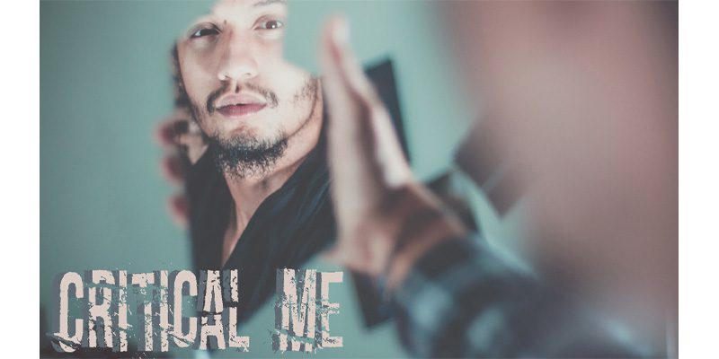 Person gazing into cracked mirror image