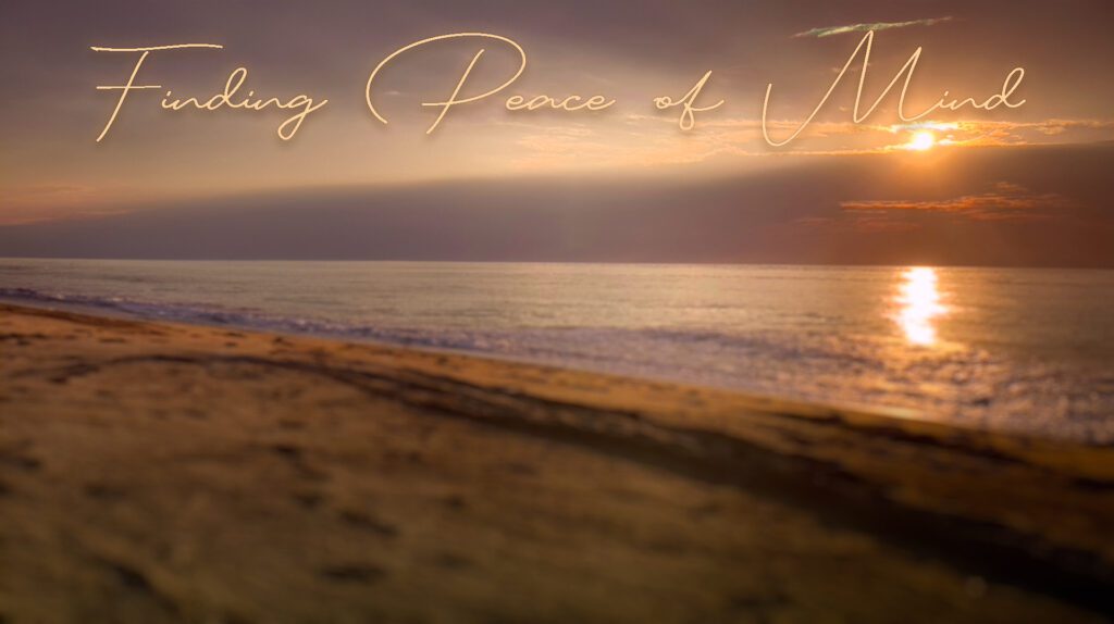 Serene beach sunset with peaceful waves and warm light.