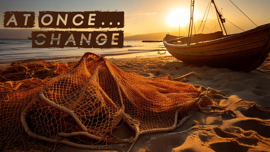 Fishing nets and boat on a beach at sunset.