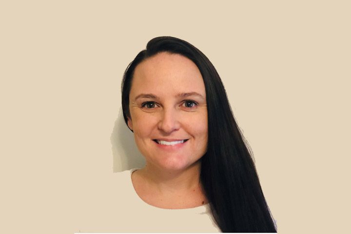Woman in white top, neutral background