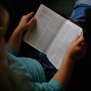 Hands holding a book close up
