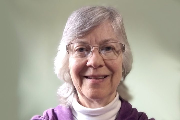 Portrait of smiling older woman in glasses