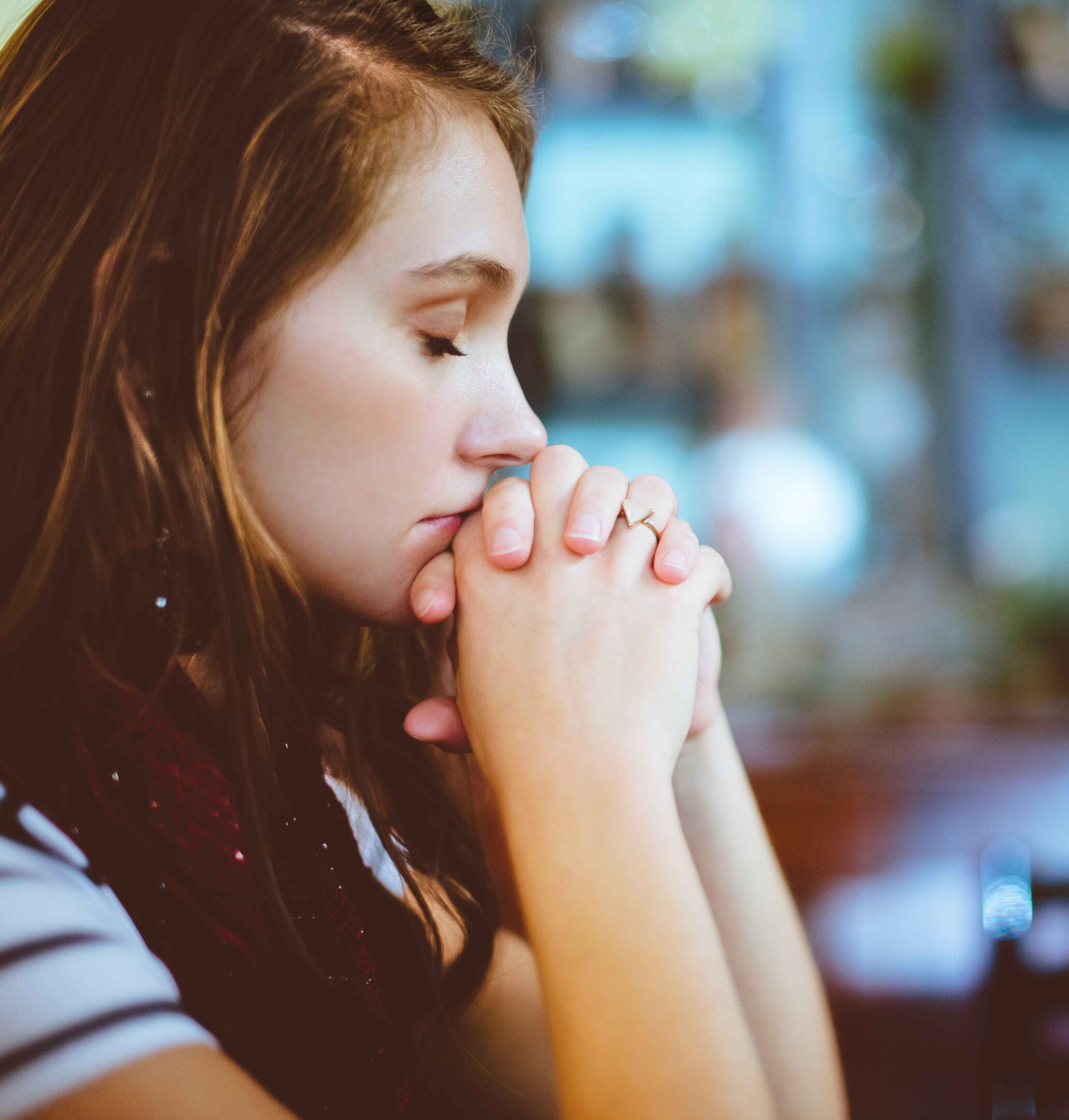 Woman deep in thought with closed eyes