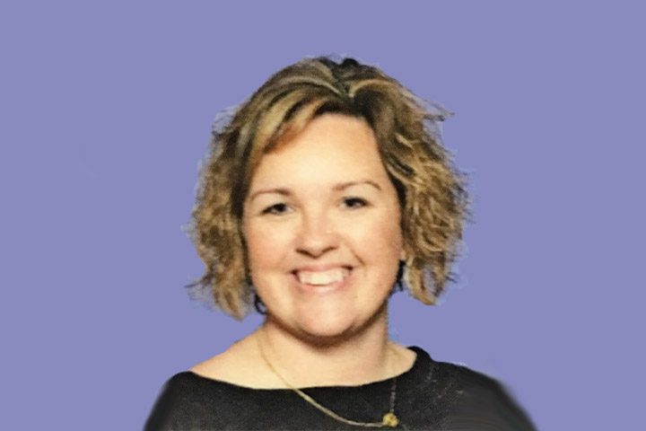 Smiling woman with short curly hair
