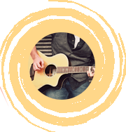 Person strumming guitar within artistic circle