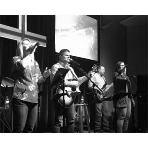 Musicians singing and playing instruments