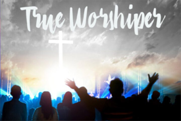 Silhouetted worshipers under a cross