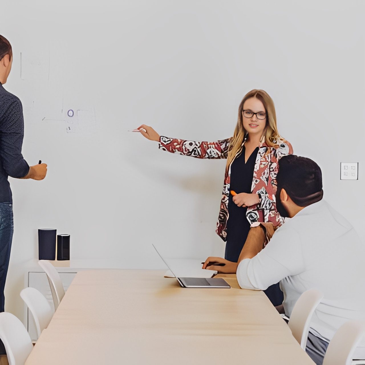 Colleagues discussing ideas in meeting room